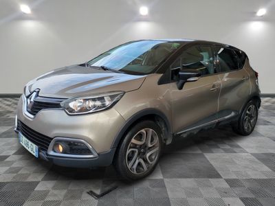 a silver car is parked on a checkered floor in a garage