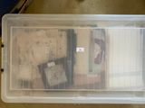 a plastic container with a lot of items inside of it