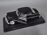 a model of a black car on a black base