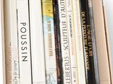 a box full of books on a white surface