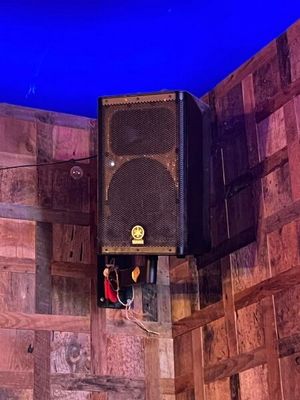 a speaker that is sitting on the wall of a room