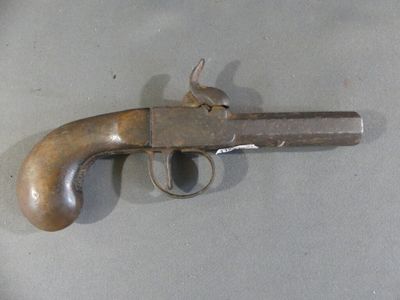 an old gun that is on the table