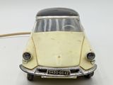 a small toy car that is sitting on a table