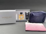 the contents of the guerlain travel set include a toilet bag, a travel bag, and a pouch