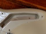 a dirty toilet with the seat up and the lid down
