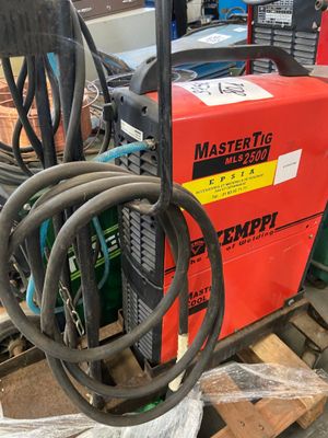 a red machine that is sitting on a pallet