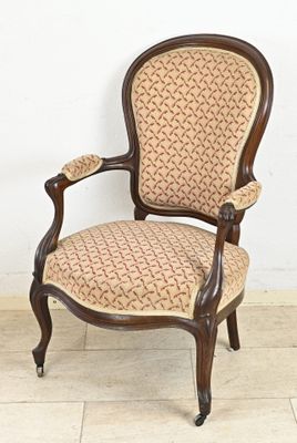 a chair that is sitting on a tile floor