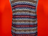 a woman ' s vest with a multicolored pattern on it