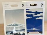 packaging of a box with a picture of a plane and a picture of a mountain