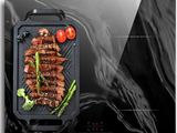 a picture of a grill with meat and vegetables on it