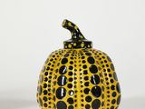 yellow and black polka dot pumpkin with a black bird on top