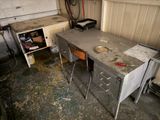 a table with a sink and a stove in a garage