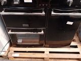 two ovens that are sitting on a pallet