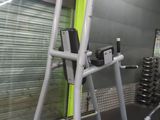 a gym equipment in a gym room with a green wall