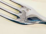 two forks that are sitting on a table