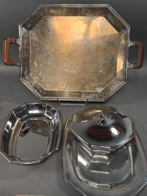 three silver plated dishes and a tray on a table
