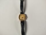 an image of a wrist watch on a white surface