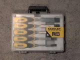 six screwdrivers in a plastic case on the floor
