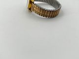 a close up of a ring on a table with a white background