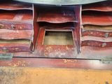 a table that has a lot of drawers on it