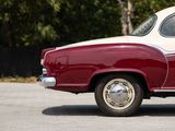 a red and white car that is parked in a parking lot