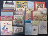 many children ' s books that are on the table