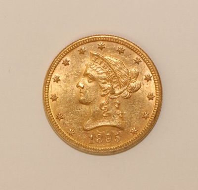 an image of a gold coin with a woman ' s head on it
