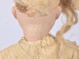 a doll that has a hat on it ' s head