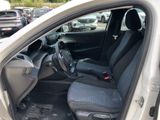 the interior of a car with the door open and the passenger seat up