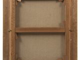 a close up of a picture of a wooden frame on a wall