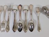 a lot of silver spoons and forks on the table