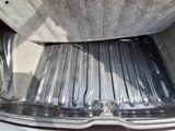 a close up of the inside of a car with the trunk door open