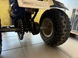 a close up view of a four wheeler vehicle parked in a garage