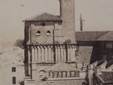 a black and white photo of a town with a clock tower