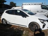 a white car that is parked in a lot