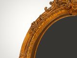 a close up of a mirror on a wall with a white background