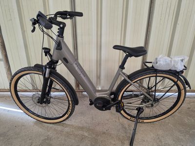 a bike that is parked in front of a wall