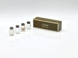three salt and pepper shakers in a box on a white surface