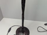a lamp that is on a table with a cord