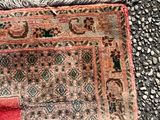 a rug on the ground with a cat laying on top of it