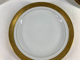 a lot of plates that are sitting on a table