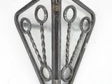 a pair of scissors that are sitting on top of a piece of metal
