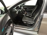 the interior of a car with the door open and the driver ' s seat up