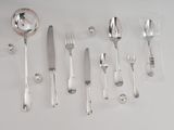 a lot of silver spoons and forks on the table