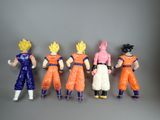 dragon ball figures lined up in a row on a gray surface