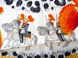 an image of a table cloth with a picture of two men on horses