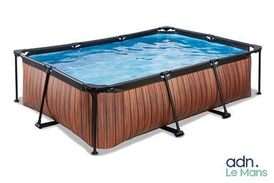 a large rectangular wooden swimming pool with a metal frame