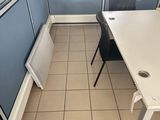 a room with a table, chairs, and a radiator in it