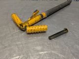 two screws and a hammer on a metal surface