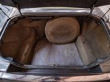 the trunk of a car with the seat up and the back seat down